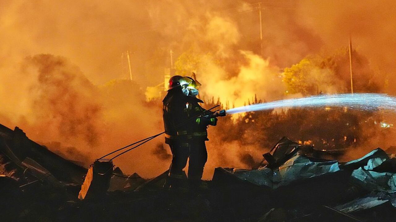 Fire rescue forces battle flames after an explosion at a fireworks plant in the Chinese city of Liuyang.