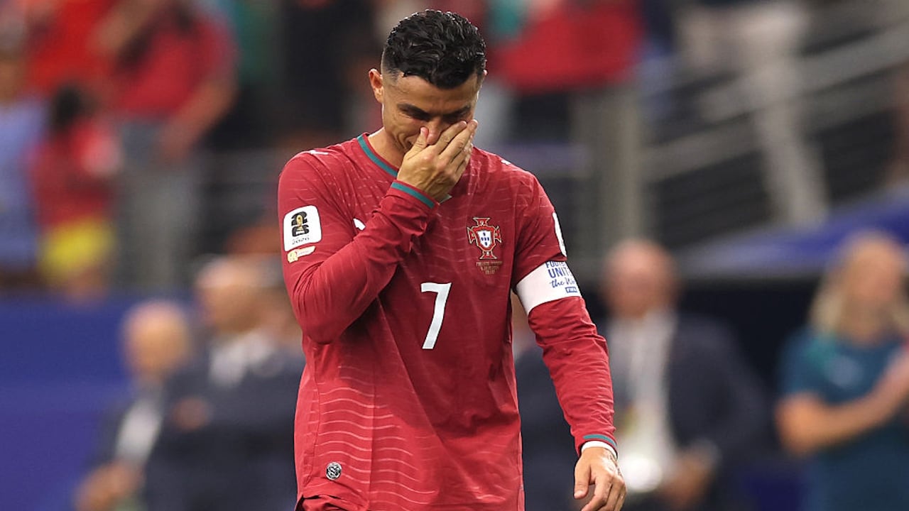 A dejected Cristiano Ronaldo walks off the pitch after Portugal lost a 1-0 match to Spain at the World Cup.