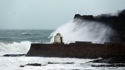 Big waves crash over the sea walls in Blackpool northwest England as a storm lashed the UK with violent storm-force winds of up to 100mph, leaving thousands of homes without power and hitting transport links Wednesday Jan. 3, 2018.